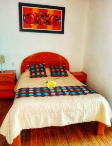 En eller flere senge i et værelse på Kusiy Qosqo Hostel