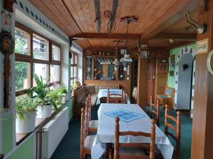 a dining room with a table in a train car at Bavorská chata in Železná Ruda