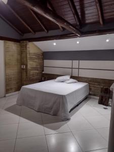 En eller flere senger på et rom på Espaço Verano - Suíte Master 2