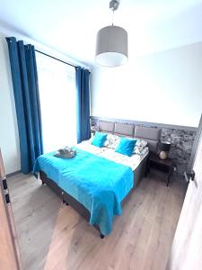 Posteľ alebo postele v izbe v ubytovaní Apartament Walczaka nr 45-MIEJSCE PARKINGOWE