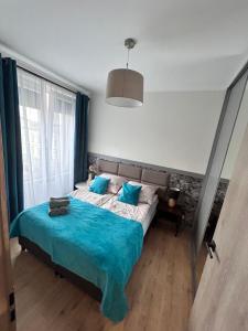 Posteľ alebo postele v izbe v ubytovaní Apartament Walczaka nr 45-MIEJSCE PARKINGOWE