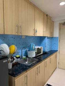 a kitchen with a sink and a counter top at Stay Cay Affordable Price by -Mang Domeng in Manila