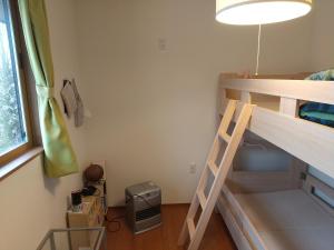Postel nebo postele na pokoji v ubytování Okunikko Guesthouse JUN