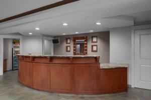 a lobby with a large wooden bar in a building at Residence Inn Long Island Holtsville in Holtsville