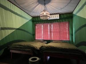 Postel nebo postele na pokoji v ubytování bo-kaap YAIZU