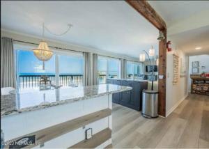 a kitchen with a counter with a view of the ocean at Pelicans Perch in Ponte Vedra Beach