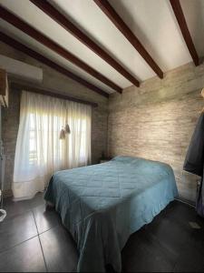 Una cama o camas en una habitación de Chacra El Timbó