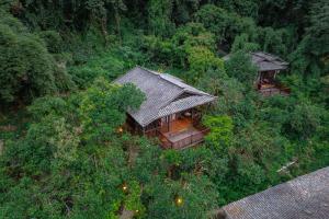 an overhead view of a house in the forest at Yangshuo Ancient Garden Boutique Hotel in Yangshuo