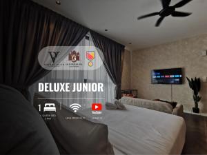 Μια τηλεόραση ή/και κέντρο ψυχαγωγίας στο Scarletz Suites KLCC by De Harlequins Guesthouse