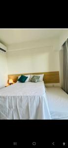 Кровать или кровати в номере apartamento de luxo Muro Alto