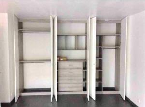 a room with white closets with white shelves at Créteil - Pointe du Lac - Le So’ in Créteil