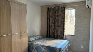 Postel nebo postele na pokoji v ubytování Condomínio Parque de jacuipe + 17 fotografií