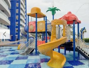 a playground with a slide in a water park at Tonsupa Diamond Beach in Tonsupa