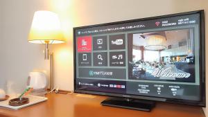 TV a/nebo společenská místnost v ubytování Utazu Grand Hotel