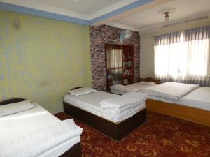 Voodi või voodid majutusasutuse Sara's Backpackers Hotel toas