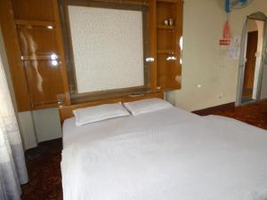Voodi või voodid majutusasutuse Sara's Backpackers Hotel toas