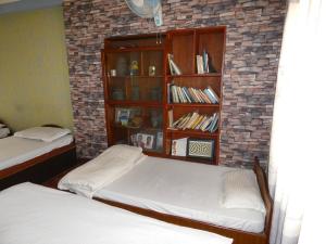 Voodi või voodid majutusasutuse Sara's Backpackers Hotel toas