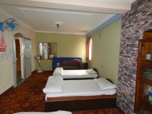 Voodi või voodid majutusasutuse Sara's Backpackers Hotel toas