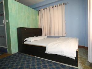 Voodi või voodid majutusasutuse Sara's Backpackers Hotel toas