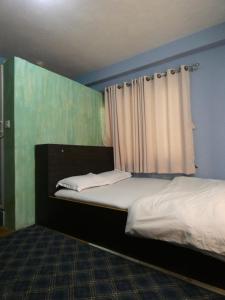 Voodi või voodid majutusasutuse Sara's Backpackers Hotel toas