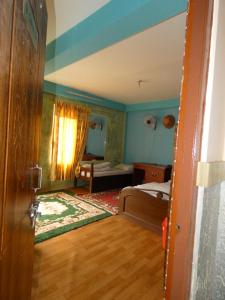 Voodi või voodid majutusasutuse Sara's Backpackers Hotel toas