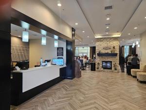 a restaurant lobby with a counter and a fireplace at Five minutes walk unit Disneyland Anaheim Staybridge Suites in Anaheim