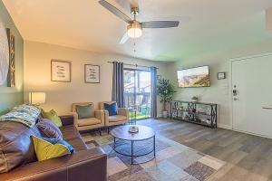 a living room with a couch and a table at Paradise Valley Village-Walk-Dine-Shop-Golf- C254 in Phoenix