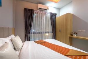 a bedroom with a white bed and a window at Mook Anda Villa in Ao Nang Beach +22 photos
