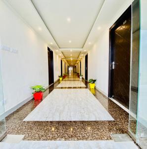 a corridor of a building with a hallway at The Four Season Resort - Top Rated & Most Awarded Property in Mussoorie in Mussoorie