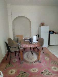 a table and two chairs in a room at Mike's Apartment in Rio
