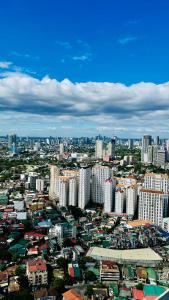an aerial view of a city with tall buildings at 2 Bedroom Condo in the center of MM in Manila