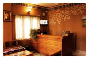 a room with a wooden counter and a window at Hotel Jigmeling in Paro