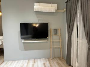 TV i/ili multimedijalni sistem u objektu ChengDian Homestay