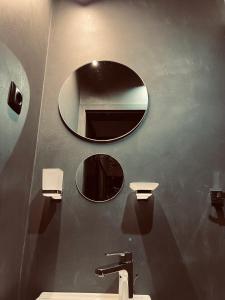 a bathroom with two sinks and a mirror at Central Apartment Black Cat in Karlovo