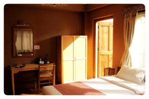 Postel nebo postele na pokoji v ubytování Hotel Jigmeling