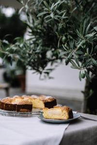 a table with two cakes on plates on a table at Waidmannhof in Merano