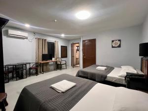 Postel nebo postele na pokoji v ubytování Hotel Capada