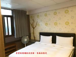 Postel nebo postele na pokoji v ubytování My House Hotel 宜蘭縣旅館280號
