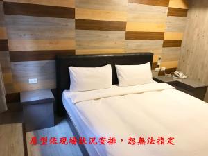 Postel nebo postele na pokoji v ubytování My House Hotel 宜蘭縣旅館280號