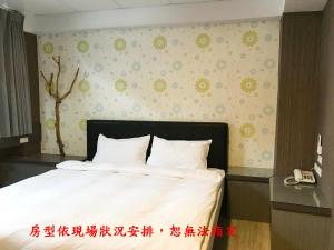 Postel nebo postele na pokoji v ubytování My House Hotel 宜蘭縣旅館280號