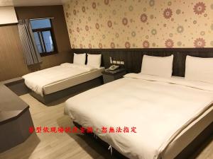 Postel nebo postele na pokoji v ubytování My House Hotel 宜蘭縣旅館280號