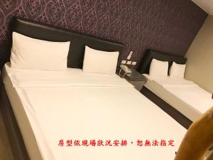 Postel nebo postele na pokoji v ubytování My House Hotel 宜蘭縣旅館280號