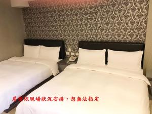 Postel nebo postele na pokoji v ubytování My House Hotel 宜蘭縣旅館280號