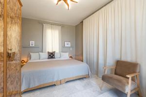 A bed or beds in a room at Helios Selene