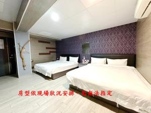 Postel nebo postele na pokoji v ubytování My House Hotel 宜蘭縣旅館280號
