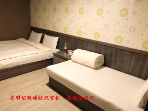 Postel nebo postele na pokoji v ubytování My House Hotel 宜蘭縣旅館280號