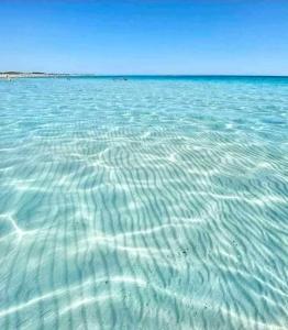 a large body of water with ripples in it at casetta nel salento in Racale