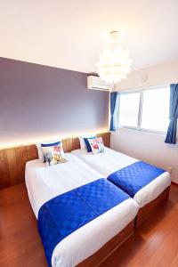 Letto o letti in una camera di Chura Minpaku Ishigaki
