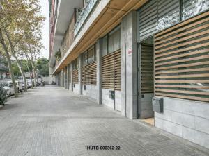 an empty sidewalk in front of a building at Alcam Futbol Pequeño in Barcelona