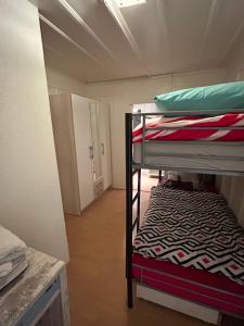 Poschodová posteľ alebo postele v izbe v ubytovaní Maison Merz